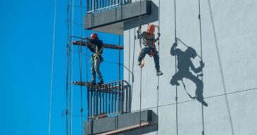 couple-workers-fixing-climbing-scaffolding-while-following-all-safety-measures_181624-46565 couple-workers-fixing-climbing-scaffolding-while-following-all-safety-measures_181624-46565