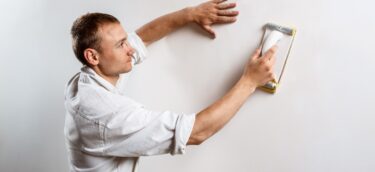 worker-grinding-white-wall-with-sandpaper_176420-4753 worker-grinding-white-wall-with-sandpaper_176420-4753